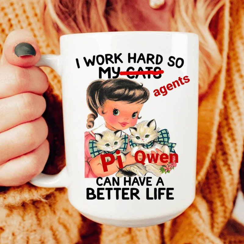 A white coffee mug held by a person with dark nail polish, featuring a vintage-style illustration of a girl in a plaid dress holding two kittens, with text that reads &lsquo;I WORK HARD SO MY CATS CAN HAVE A BETTER LIFE&rsquo; where &lsquo;MY CATS&rsquo; is crossed out and replaced with &lsquo;agents&rsquo; in red, and cats show labels &lsquo;Pi&rsquo; and &lsquo;Qwen&rsquo; set against a cozy knitted sweater background.